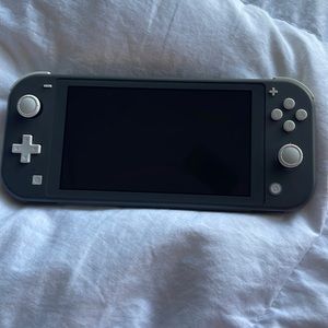 Grey Nintendo switch Lite and games